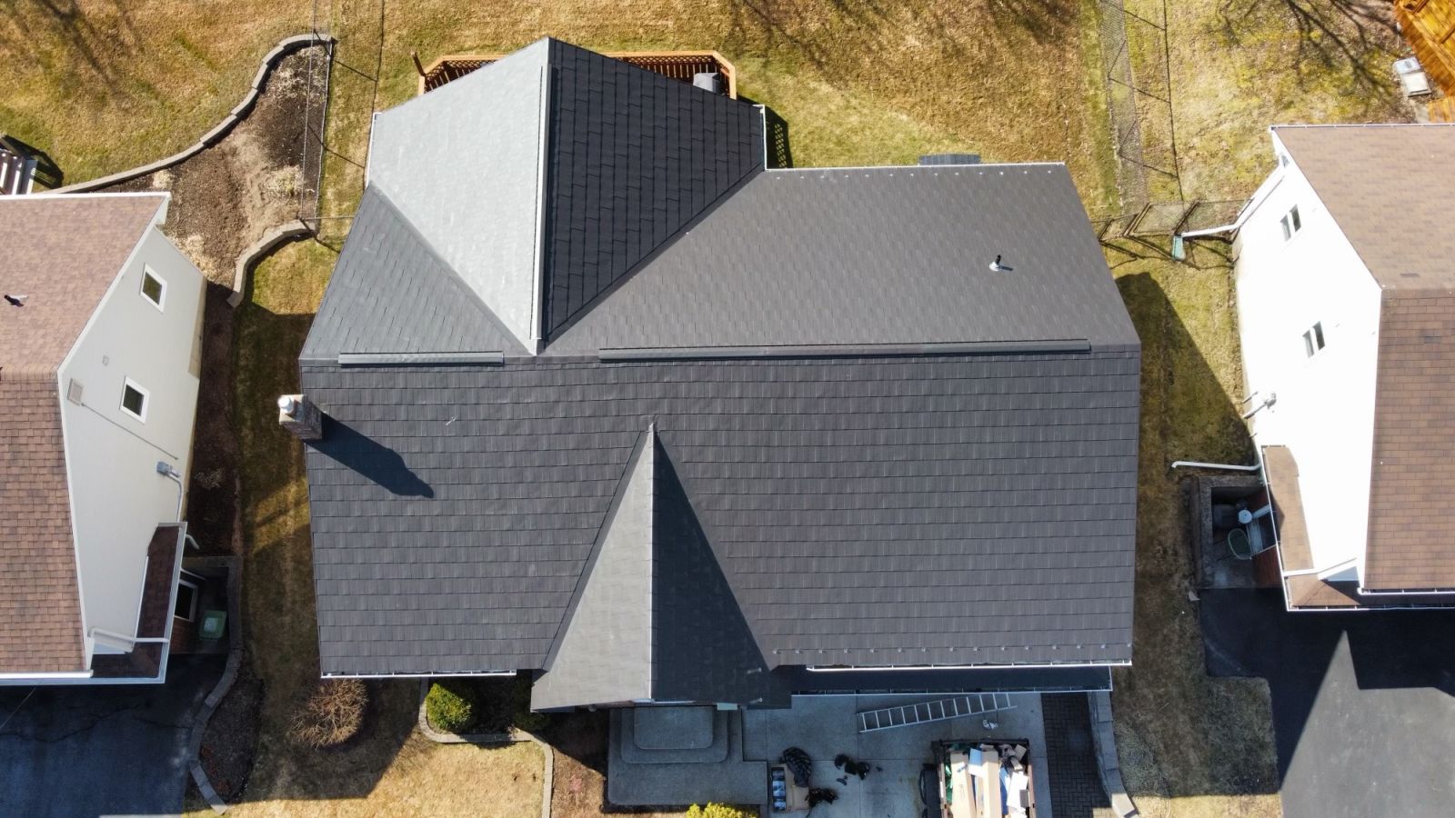 Asphalt gray colored shingles on a residential home installed by P&P Roofing