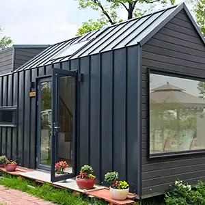 Tiny home with black metal siding